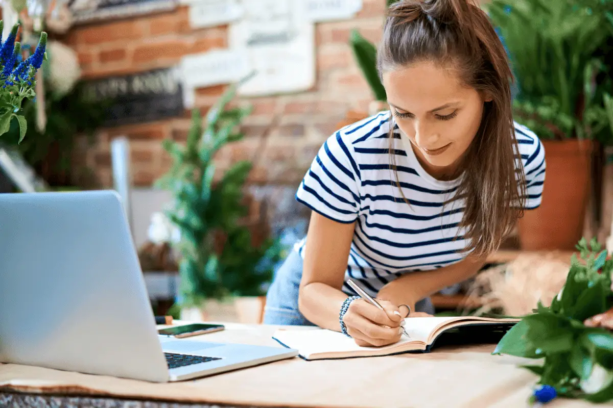 girl writing in notebook become a professional organizer